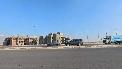 Driving Through Bright Neighborhood Streets New Cairo Showing Buildings Traffic Видео 329856477