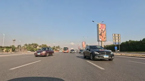 Driving Through The Busy Streets Of New Cairo Showing Buildings Traffic Vehicles Stock Footage 329867365