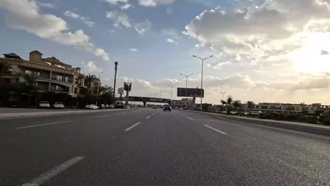Driving Through Calm Urban District Streets New Cairo Showing Buildings Traffic Video stock 329660869