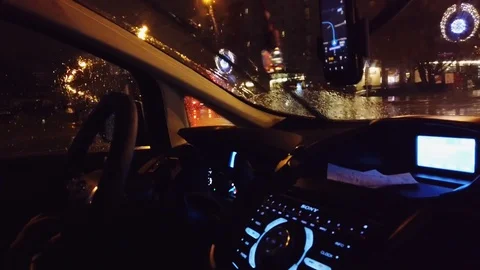 Driving through the citi during the night on the rain using GPS navigation. Stock Footage 127611456