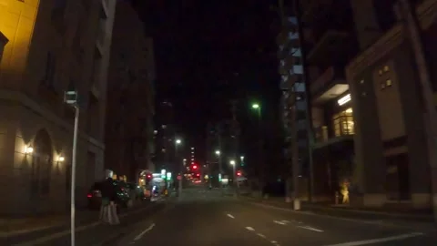 Driving through the city at night Stock Footage 241154061