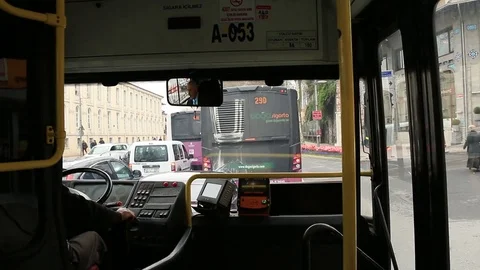 Driving through city streets inside the bus Stockbeeldmateriaal 84207718