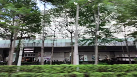 Driving through the city while looking at the urban scenery Stock Footage 289452696