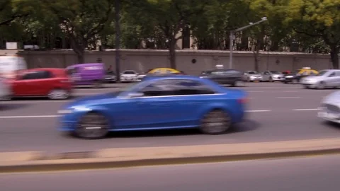 Driving through the city, window side POV - cars, buildings, traffic, park Stock Footage 121116447