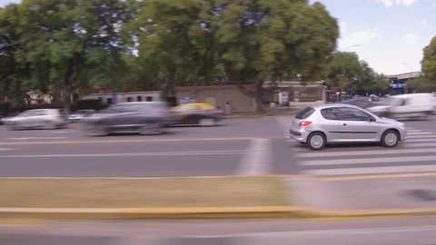 Driving through the city, window side POV - cars, buildings, traffic, park. Stock Footage 121118329