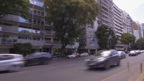 Driving through the city, window side POV - cars, buildings, traffic, park. Stock Footage 121161576