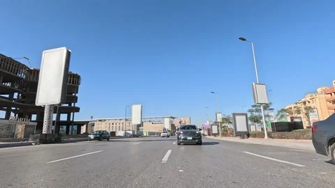 Driving Through Clean Planned Urban Streets New Cairo Showing Buildings Traffic Stock Footage 329675990