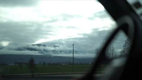 Driving through cloudy rural British Columbia in slow motion and 60fps Stockbeeldmateriaal 127476849
