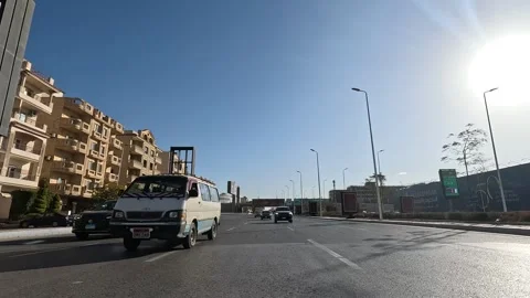 Driving Through Contemporary City District Roads New Cairo Showing Buildings Stock Footage 329673725