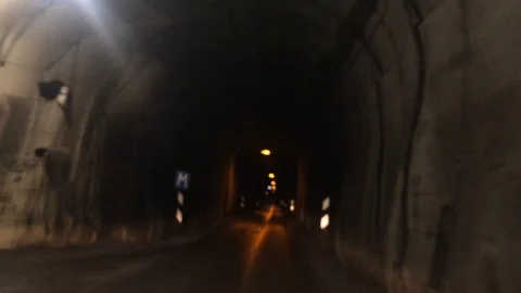 Driving through a dark and narrow cave-like tunnel in Iceland Stock Footage 89020925
