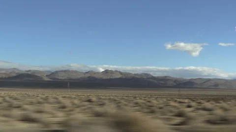 Driving Through desert with landscape passing by from car Stock Footage 127207823