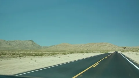 Driving through the dessert with a mountain landscape 스톡 동영상 79851164