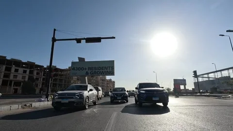 Driving Through District Roads New Cairo Showing Buildings Traffic Vehicles And Stock Footage 329673763