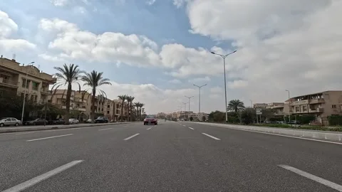 Driving Through District Roads New Cairo Showing Buildings Traffic Vehicles And Stock Footage 330114477