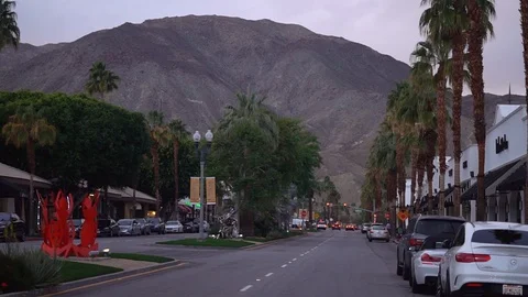 Driving through El Paseo boulevard during cold dark evening in Palm Desert Stock Footage 107942816