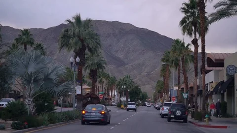 Driving through El Paseo boulevard during cold dark evening in Palm Desert Stock Footage 107942833