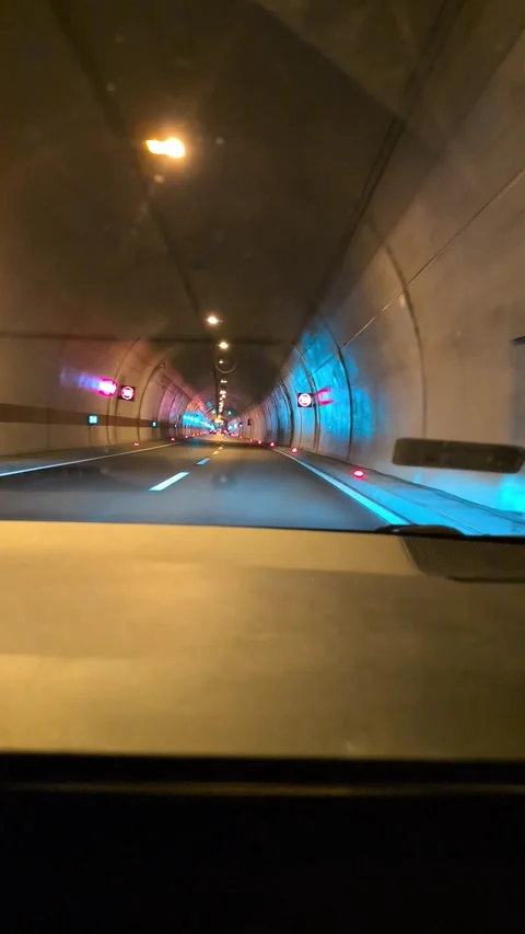 Driving Through an Empty Curving Road Tunnel Stock Footage 341696847
