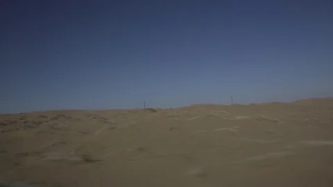 Driving through an empty Desert Stock Footage 75212966