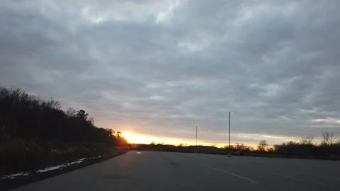 Driving Through Empty Open Parking Lot With Beautiful Golden Sunset In Dista Stock-Footage 153704270