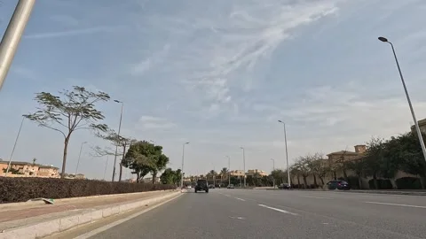 Driving Through Expanding City District Streets New Cairo Showing Buildings Vídeos de archivo 329758739