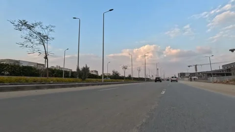 Driving Through Expansive Urban District Roads New Cairo Showing Buildings Video stock 329901140