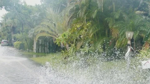 Driving through flooded roads in slow motion Stock Footage 80218938