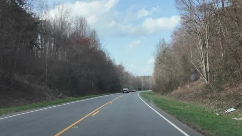Driving Through a Forested Area in North Carolina During Spring Stock Footage 332304588
