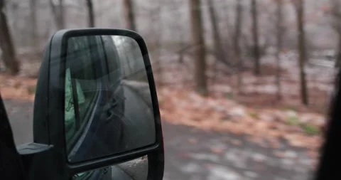 Driving through germany in a dark van watching from a rear view mirror Stock Footage 230318056