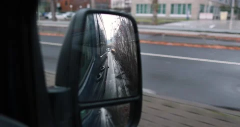Driving through germany in a dark van watching from a rear view mirror Stock Footage 230318124