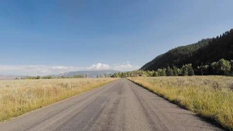 Driving through Grand Teton park, sunny 2.7k Ultra HD Stock Footage