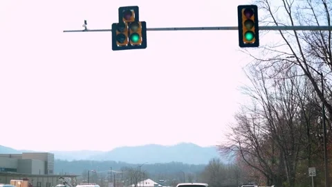 Driving through a green traffic light, mountain view, driving landscape Stock Footage 273538756