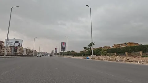 Driving Through Growing Streets New Cairo Showing Modern Buildings Traffic And Video stock 330106833