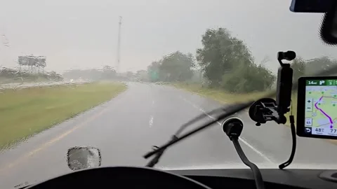 Driving through heavy rain on an empty highway Stock Footage 281764143