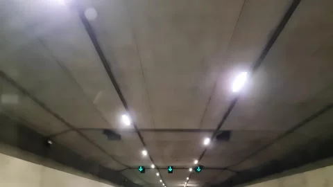 Driving through a highway road tunnel 库存影片 333523712