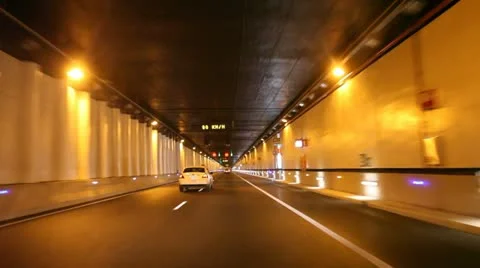 Driving through a highway tunnel 库存影片 12573229
