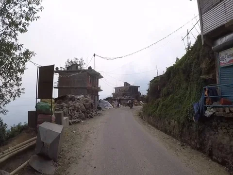 Driving through Himalayan mountain Town Stock Footage 80709925