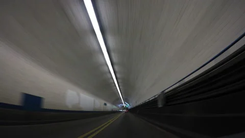 Driving through an illuminated underpass or road tunnel Video stock 154742068