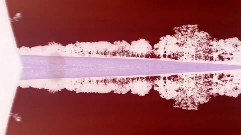 Driving through landscape with reality bending surreal mirror effect.  Stock Footage 140791377