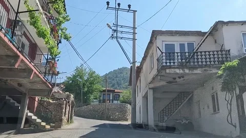 Driving through the lanes of a small old village. First person Stock Footage 277984028