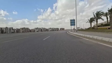 Driving Through Large Streets New Cairo Showing Urban Buildings Traffic And Stock-Footage 329659200