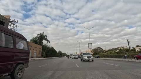 Driving Through Large Streets New Cairo Showing Urban Buildings Traffic And Vidéo 329701000