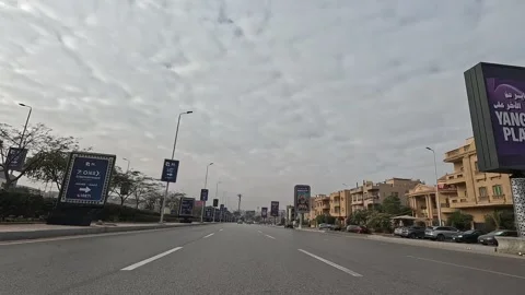 Driving Through Large Streets New Cairo Showing Urban Buildings Traffic And Stock Footage 329725748