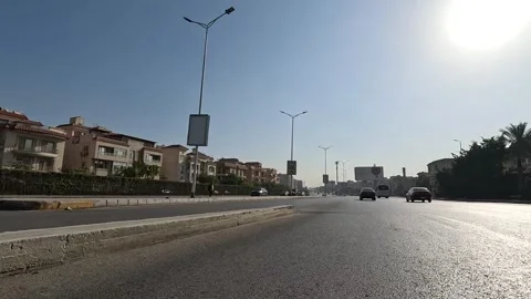 Driving Through Large Streets New Cairo Showing Urban Buildings Traffic And Stock Footage 329801068