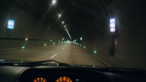 Driving Through a Lit Tunnel Enhanced by the Dashboard Lights of the Vehicle Stockbeeldmateriaal 302220194