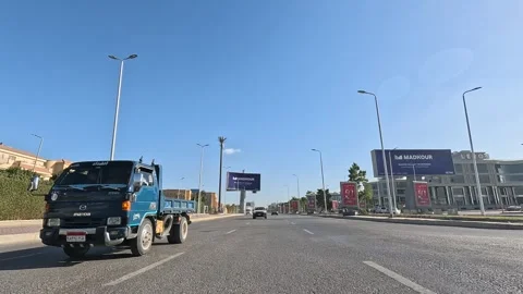 Driving Through Lively City District Roads New Cairo Showing Buildings Traffic Stock-Footage 329675092