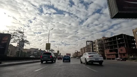 Driving Through Lively Streets New Cairo Showing Buildings Traffic Vehicles And Stock Footage 329695171