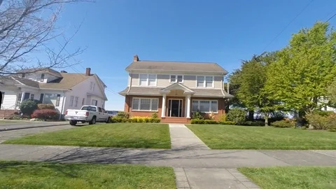 Driving through a middle class suburban neighbor hood showing houses Stock Footage 106690290