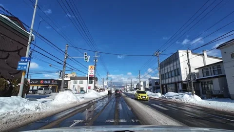 Driving through mixed urban area with mountain in Hakodate winter city Video stock 333069452