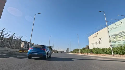 Driving Through Modern Urban District Streets New Cairo Showing Buildings Stock Footage 329671704
