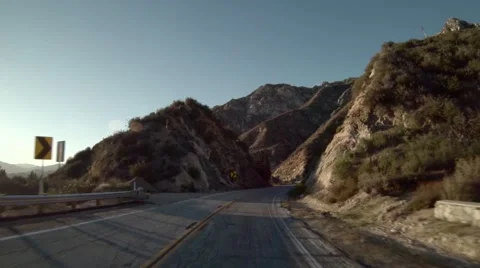 Driving through a mountain highway Slow Motion Video stock 40387194
